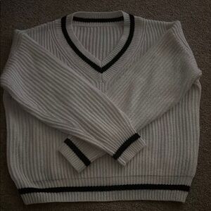 Woman’s White V-Neck Sweater with Black Trim
